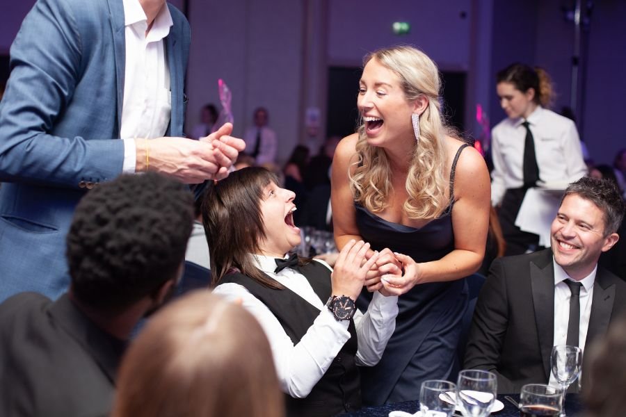 Corporate guests reacting to close-up magic